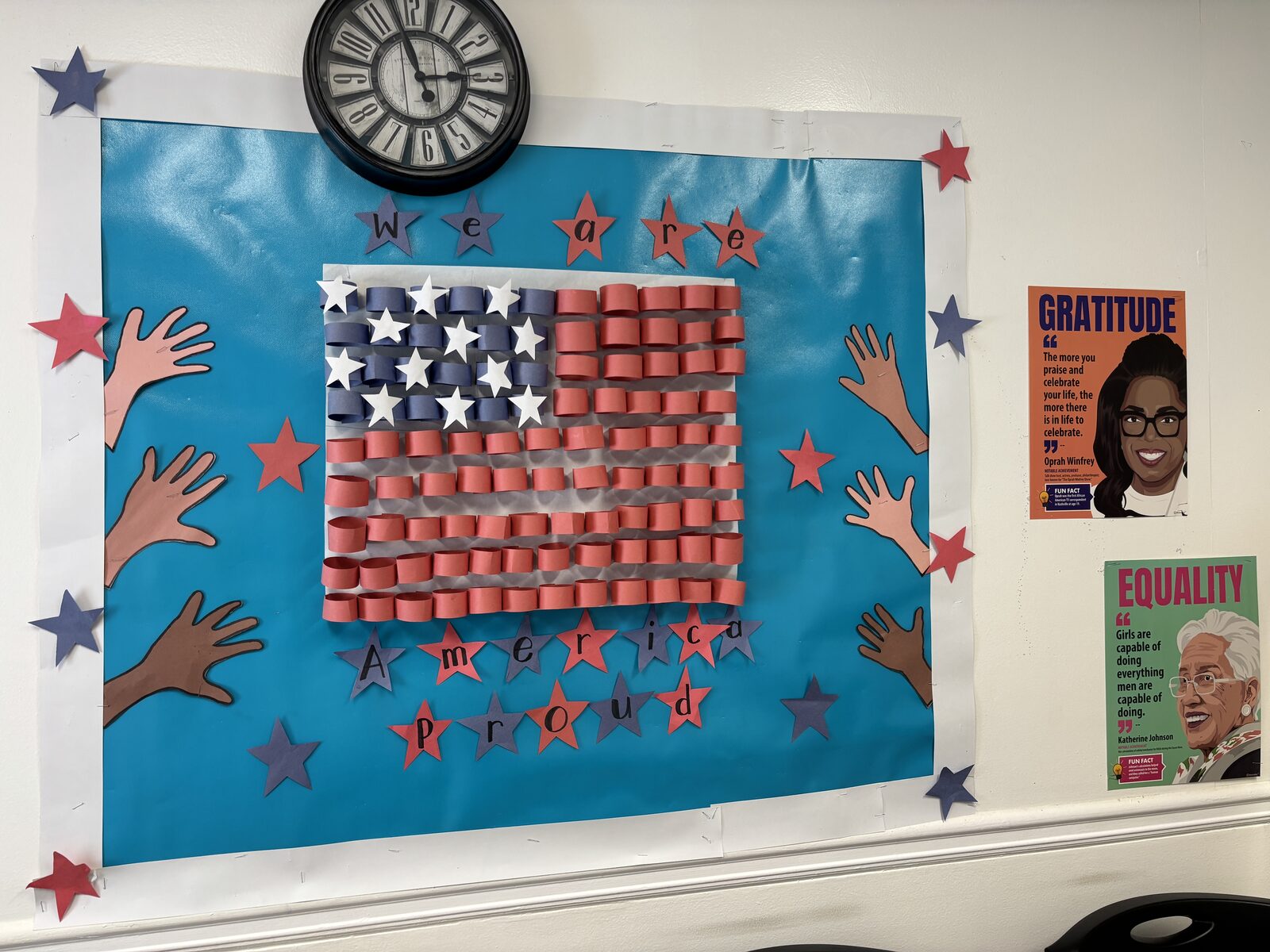 We Are America Proud bulletin board with student artwork at Marietta Academy