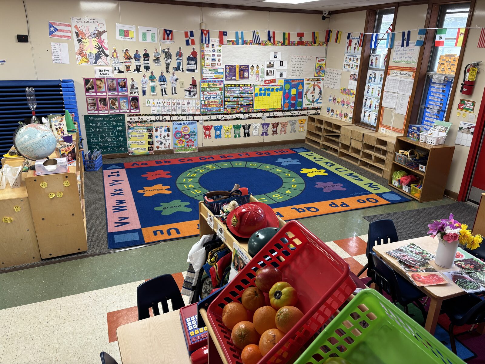 Preschool classroom with alphabet rug and world flags celebrating cultures at Marietta Academy