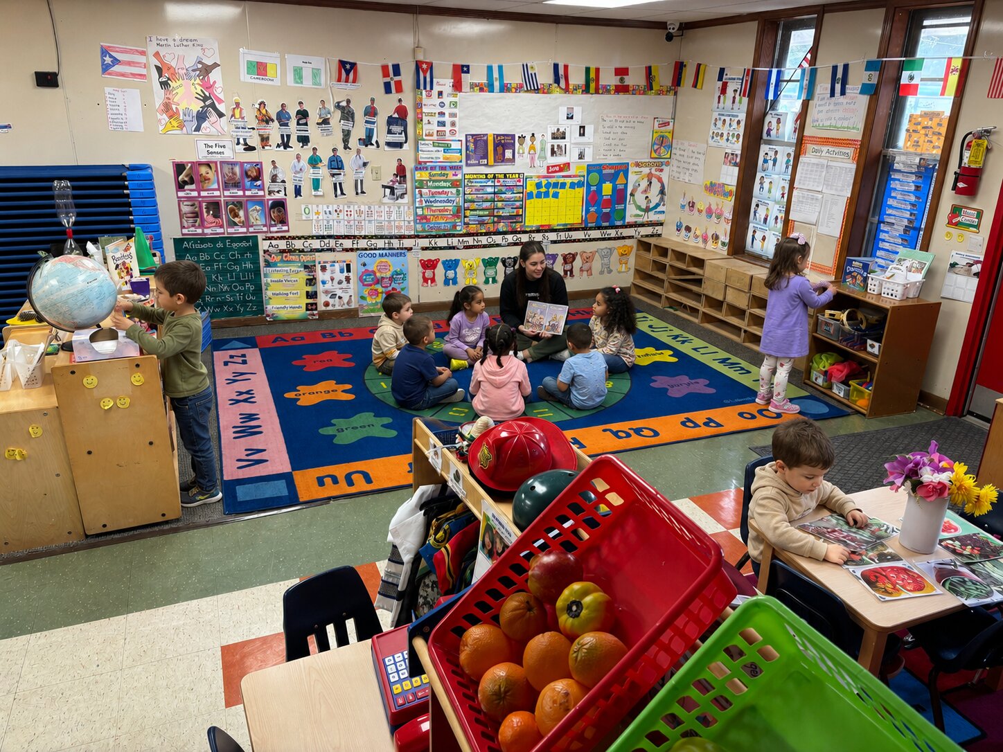 Pre-K teacher reading a story at Marietta Academy in Marietta, GA