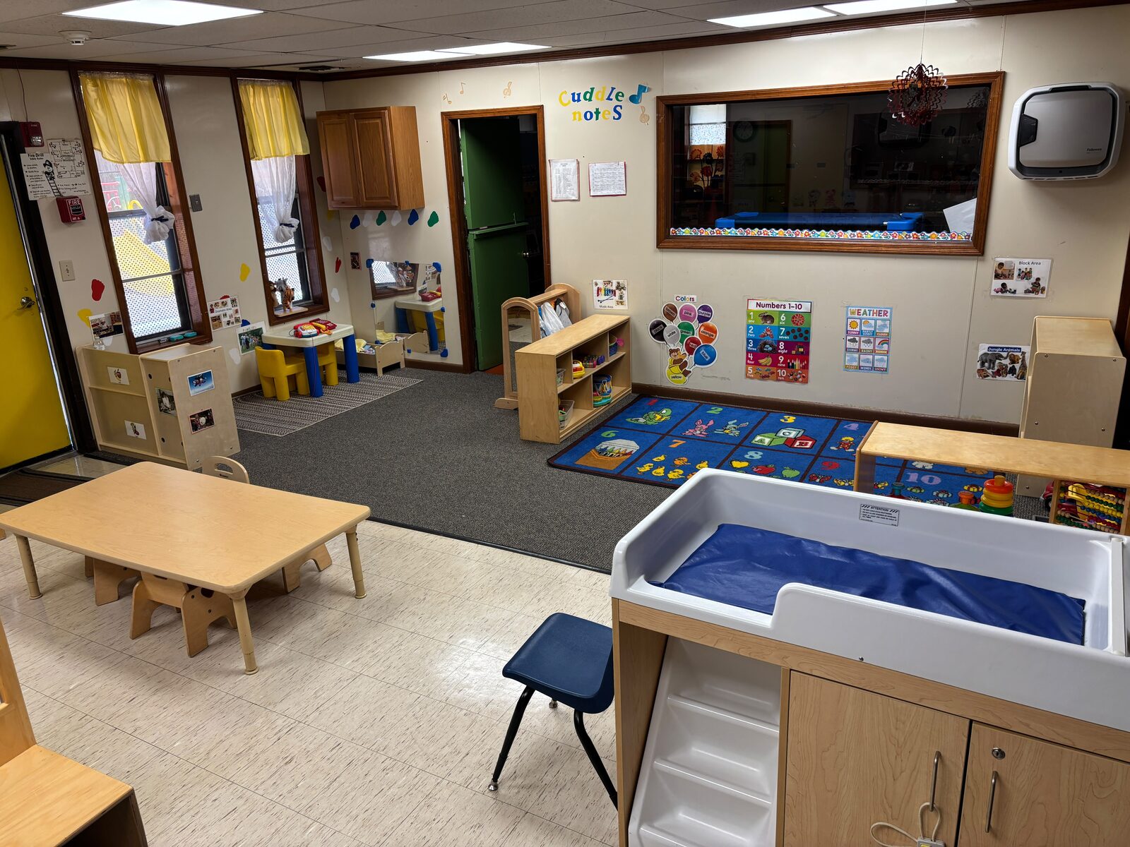 Toddler classroom with learning centers and changing station at Marietta Academy in Marietta, GA